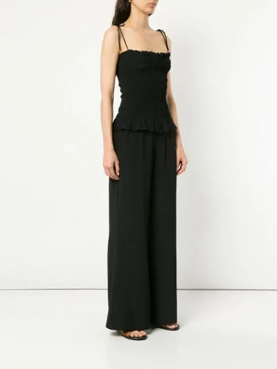 Shop Tory Burch Smocked Jumpsuit In Black