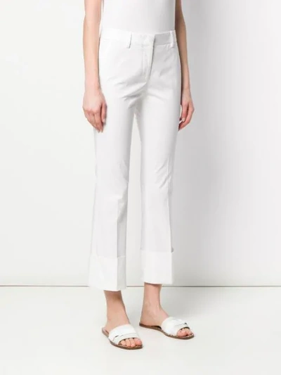 Shop Alberto Biani Turned Up Hem Trousers In White