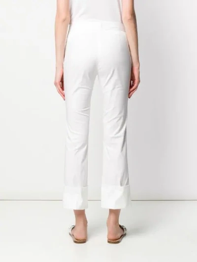 Shop Alberto Biani Turned Up Hem Trousers In White