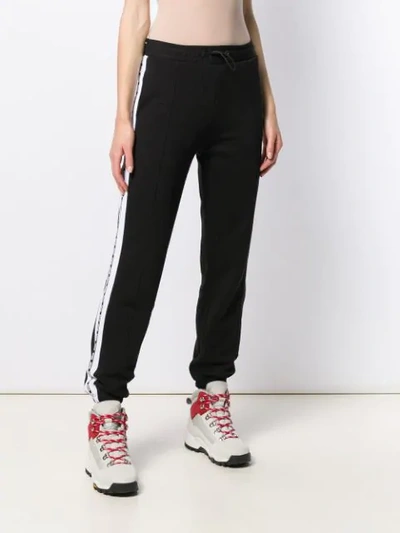 Msgm Embroidered Cotton-blend Fleece Track Pants In Black