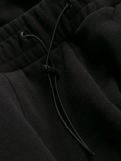 Msgm Embroidered Cotton-blend Fleece Track Pants In Black