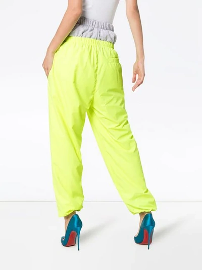 Shop Natasha Zinko Double Layer Logo Print Cotton Track Pants In Yellow