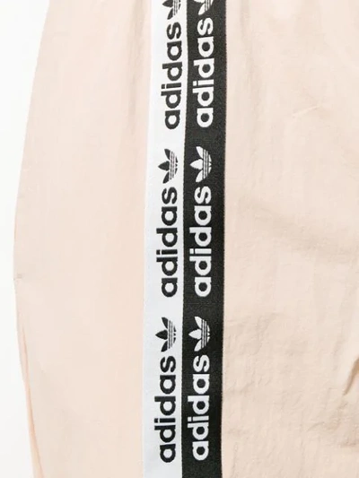 Shop Adidas Originals Logo Tape Track Pants In Neutrals