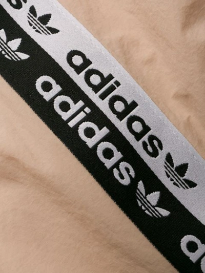 Shop Adidas Originals Logo Tape Track Pants In Neutrals