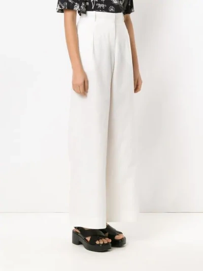 Shop Alcaçuz Flores Wide Leg Trousers In White