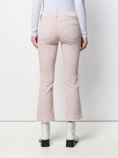 Shop J Brand Cropped Flared Jeans In Pink