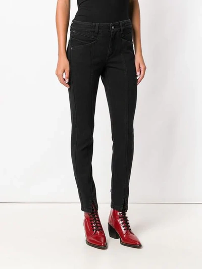 Shop Givenchy Front Slit Trousers In Black