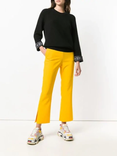 Shop Msgm Cropped Bootleg Trousers In Yellow