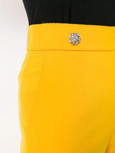 Shop Msgm Cropped Bootleg Trousers In Yellow
