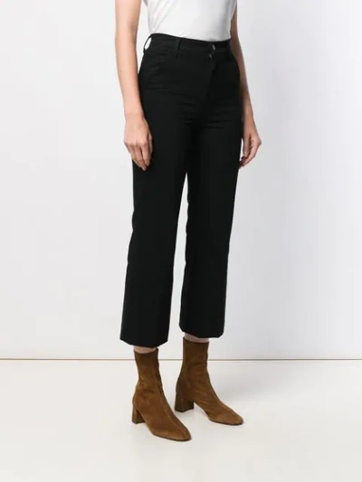 Shop J Brand Flared Cropped Jeans In Black