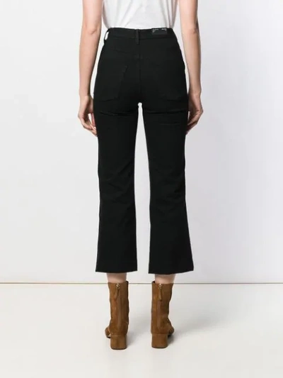 Shop J Brand Flared Cropped Jeans In Black