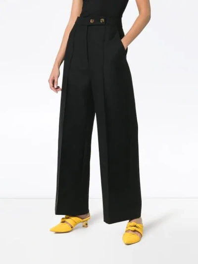Shop Khaite Yasmin Pleated Wide-leg Trousers In Black