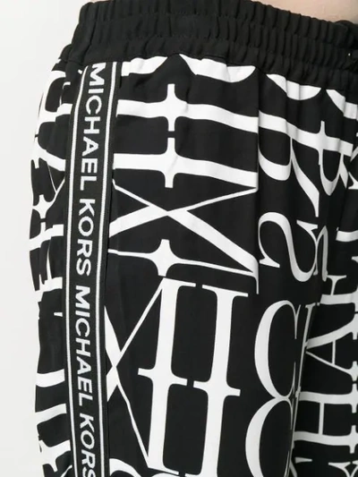 Shop Michael Kors Logo Print Track Pants In 048 Black/white