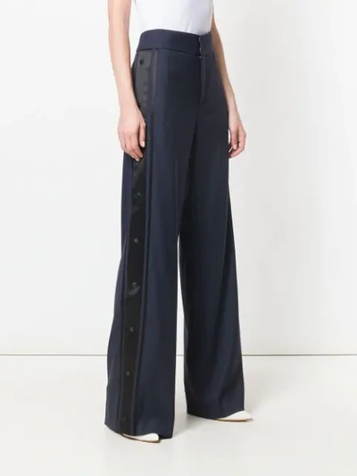 side pinned flared trousers
