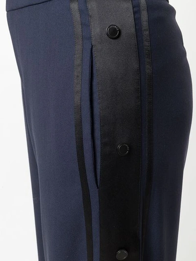 side pinned flared trousers