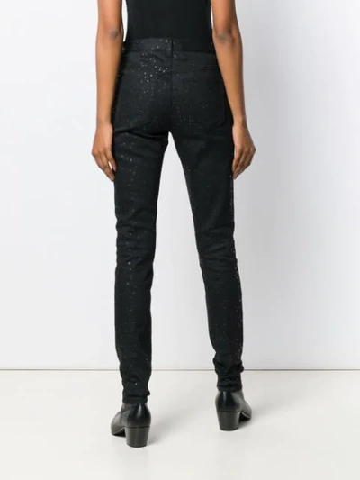 Shop Saint Laurent Star Print Skinny Jeans In Black