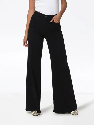 Shop Frame Le Palazzo Wide-leg Jeans In Black