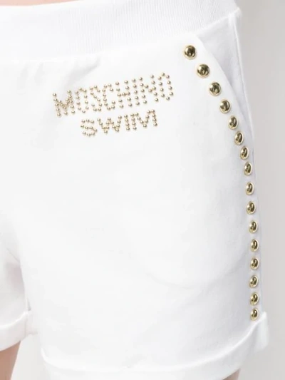Shop Moschino Swim Studded Shorts - White