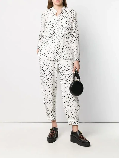 Shop Stella Mccartney Polka Dot Tapered Trousers In White