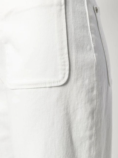 Shop Etro Flared Embroidered Jeans - White