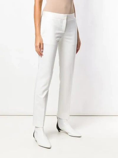 Shop Theory Creased Skinny Trousers In White