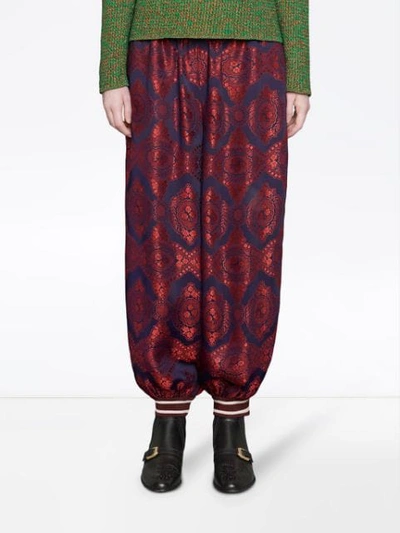 Shop Gucci Contrast Print Silk Track Pants In Red