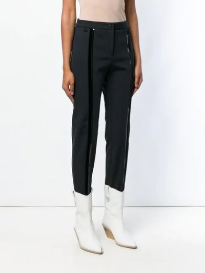 Shop Fendi Stirrup Slim-fit Trousers In Black
