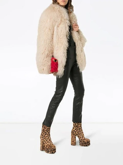 Shop Saint Laurent Collarless Shaggy Fur Jacket - White