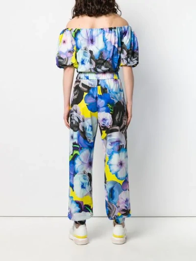 Shop Msgm Floral Print Jumpsuit In Blue