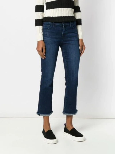 Shop J Brand Flared Cropped Jeans In Blue