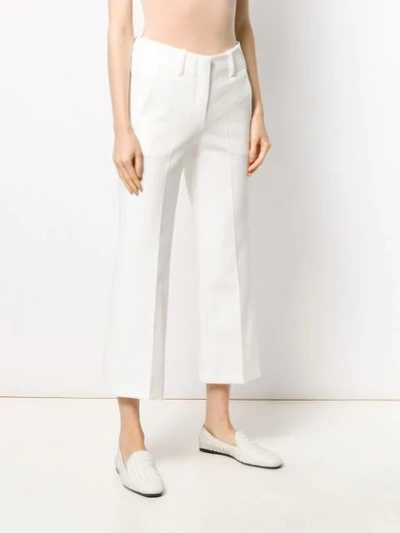 Shop Alysi Twill Kick Flare Trousers In White