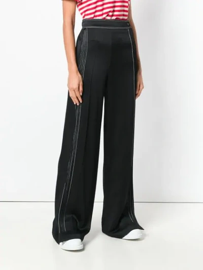 Shop Valentino Contrast-stitch Palazzo Pants In Black