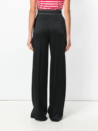 Shop Valentino Contrast-stitch Palazzo Pants In Black