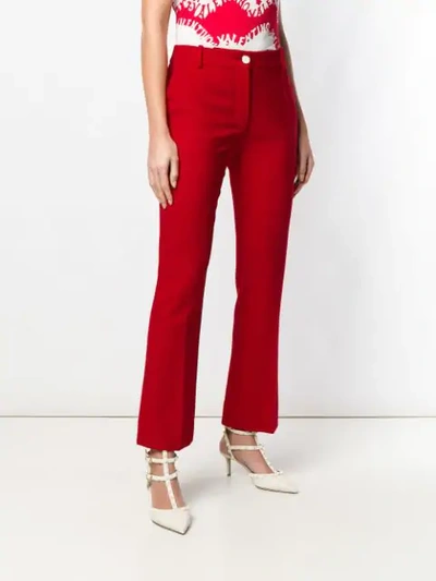 Shop Valentino Tailored Flared Trousers In Red
