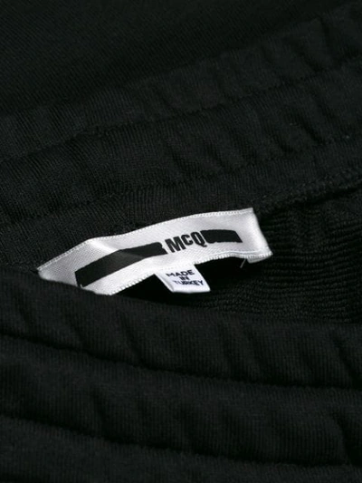 Shop Mcq By Alexander Mcqueen Cropped Repeat Logo Track Pants In Black