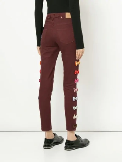 Shop Tu Es Mon Tresor Bow Embellished Cropped Jeans In Red