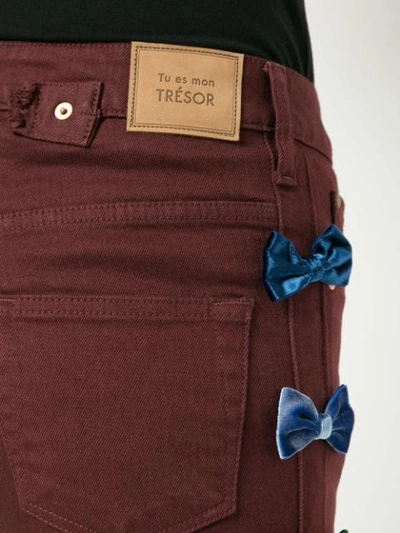 Shop Tu Es Mon Tresor Bow Embellished Cropped Jeans In Red