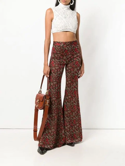 Shop Chloé Swirl Print Kick Flare Trousers In Red