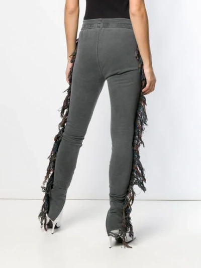 Shop Alchemist Ripped Fringed Track Pants In Black