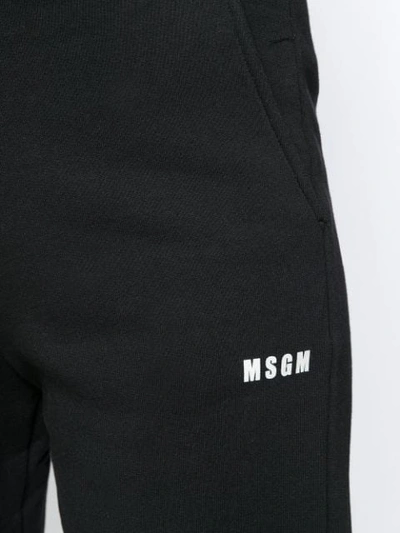 Shop Msgm Logo Print Track Pants In Black