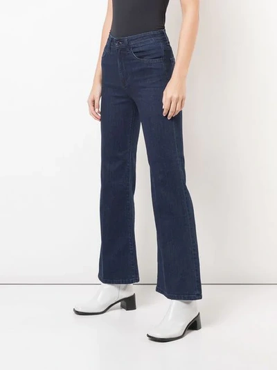 Shop Eve Denim Flared High Waisted Jeans In Blue