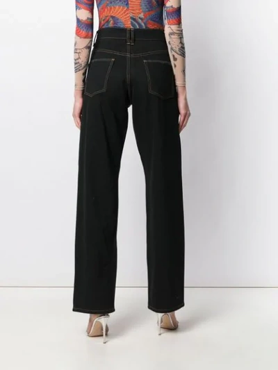 Shop Koché Flared Jeans With Embellishments In Black