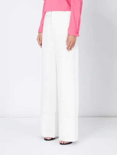 Shop Oscar De La Renta High-rise Flared Trousers In White