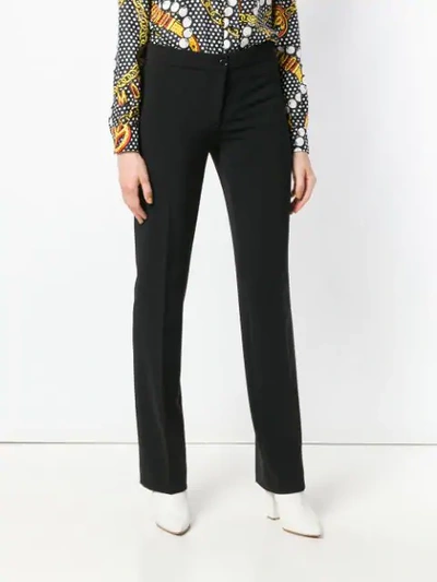 Shop Moschino Tailored Trousers In Black