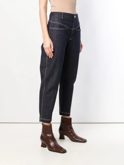 Shop Fendi Cropped Tapered Jeans In Blue