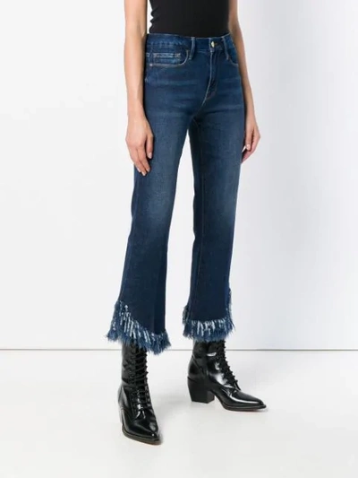 Shop Frame Frayed Hem Cropped Jeans In Blue