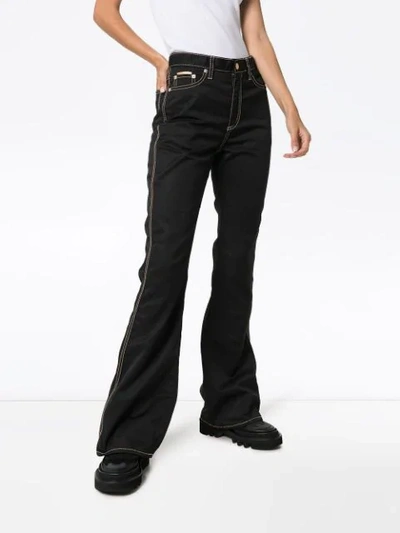 Shop Eytys Oregon Flared Jeans In Black