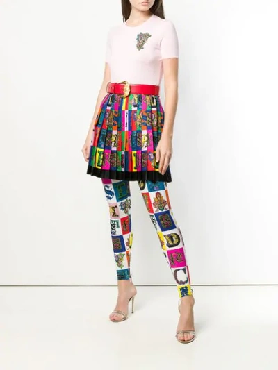 Shop Versace Logo Print Pleated Mini Skirt In A7000 Multicolor