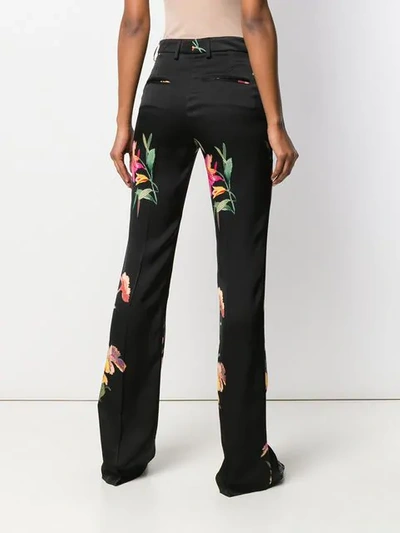 Shop Etro Floral Print Flared Trousers In Black