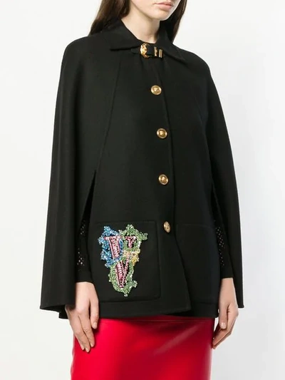 Shop Versace Buttoned Cape Jacket In Black